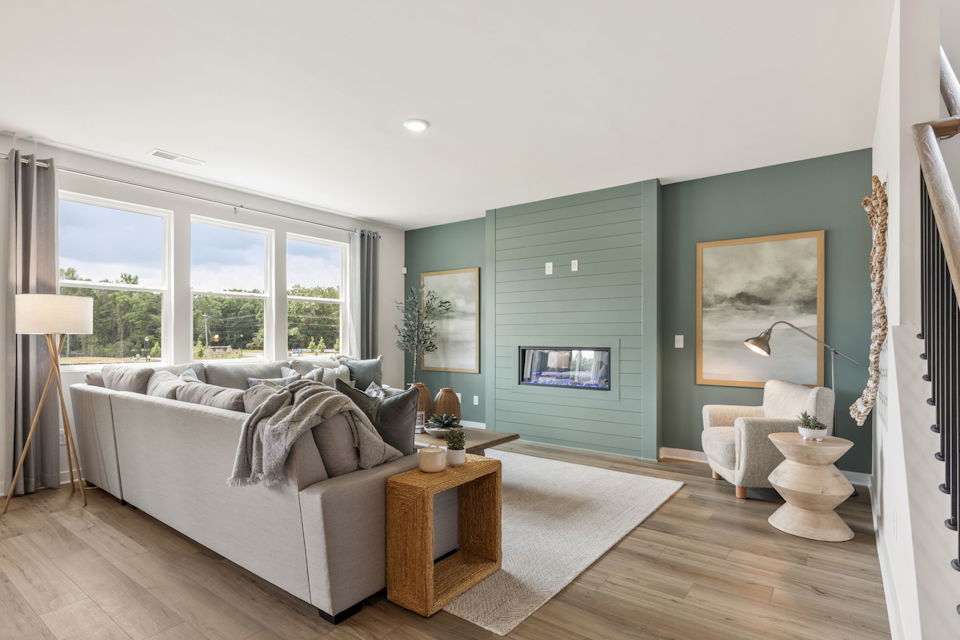 A living room with a couch and a table.