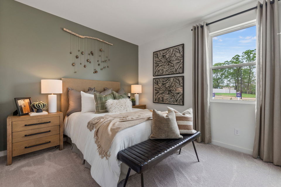 A bedroom with a large bed.