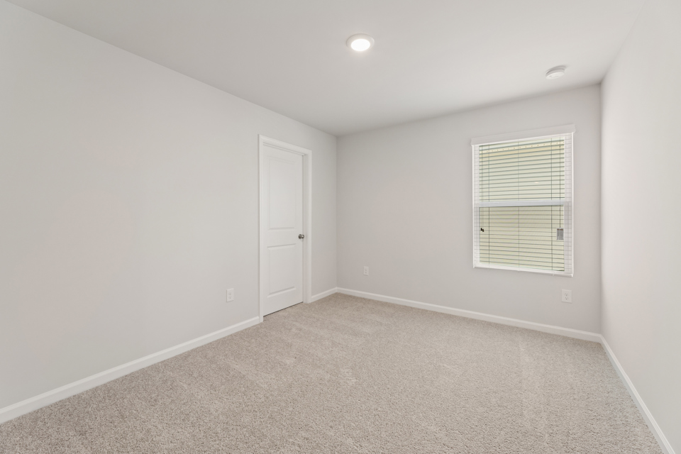 A room with a door and a window.