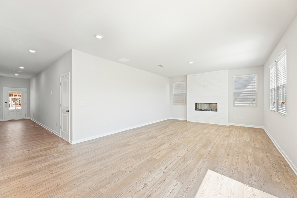 A room with a wood floor and a wood floor.