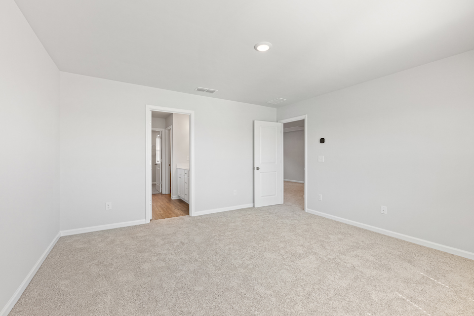 A hallway with white walls.
