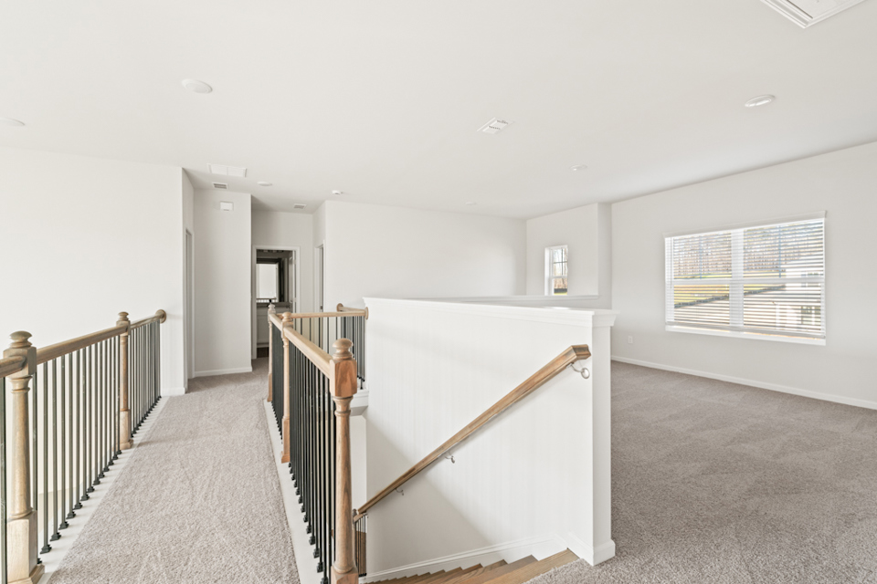 A long hallway with a railing.