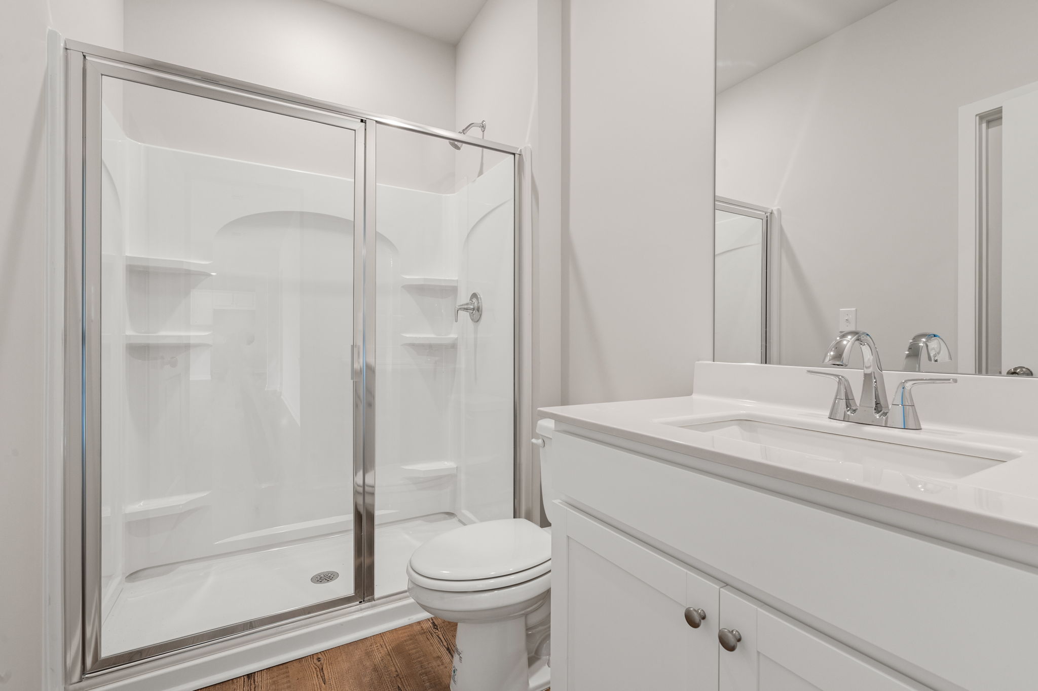 A bathroom with a glass shower.