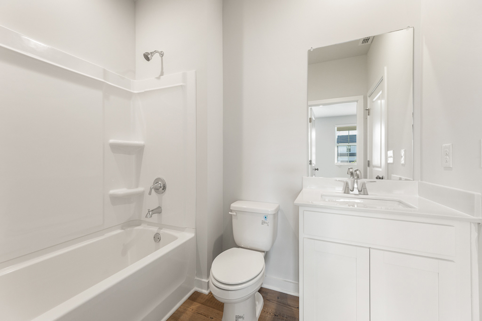 A bathroom with a toilet and sink.