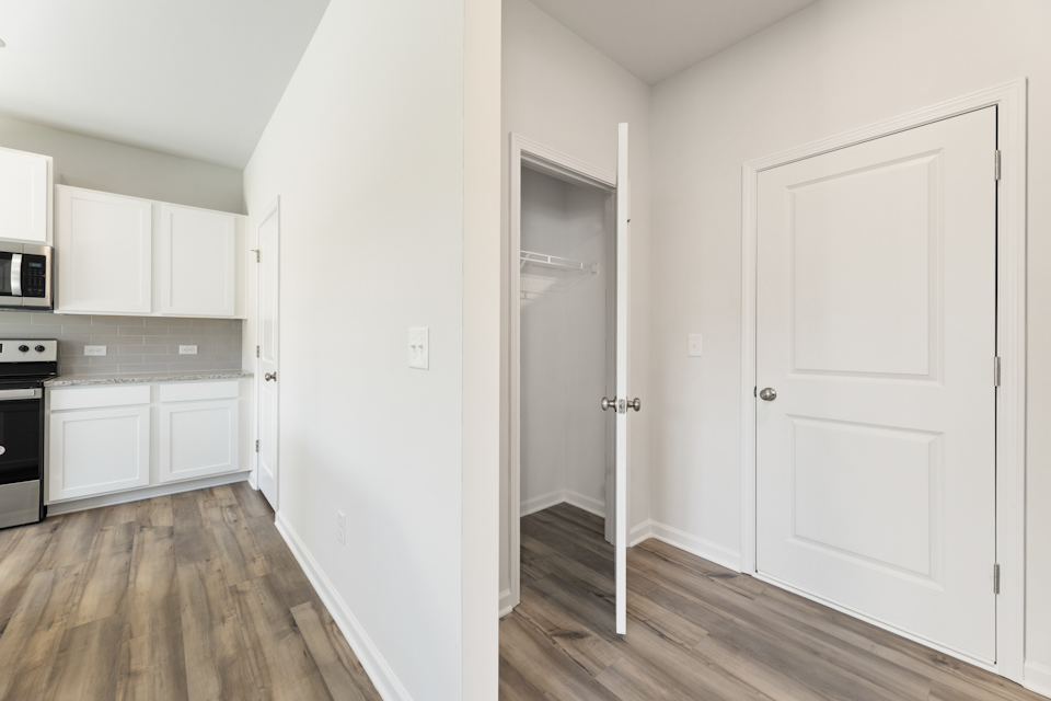 A room with white cabinets.