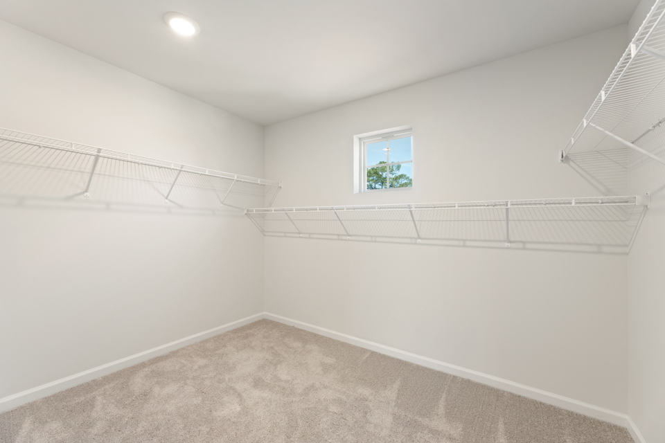 A white room with a window.