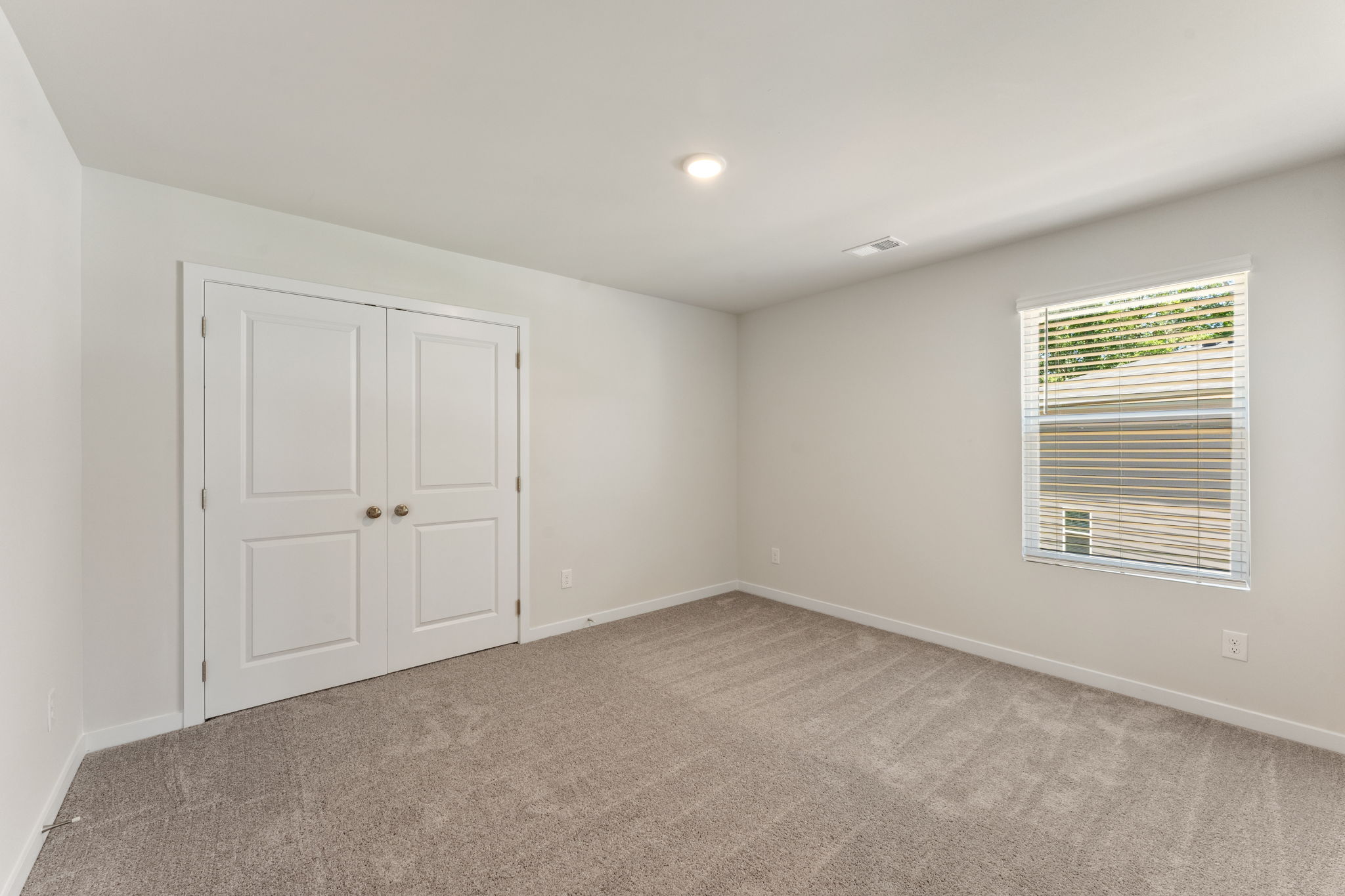 A room with white doors.