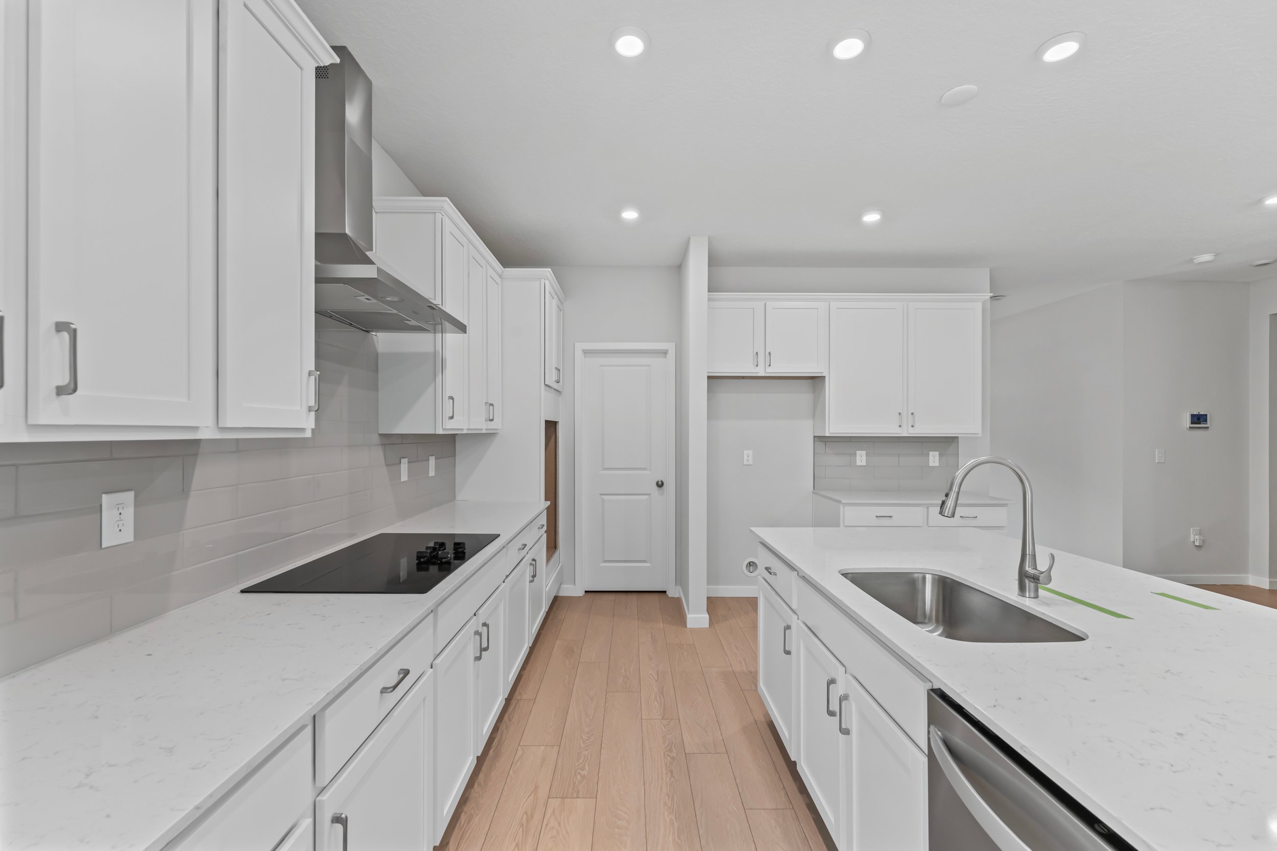 Dogwood Plan Lot 582 Chef's Kitchen with White Cabinets at NorthShore in Kingsland