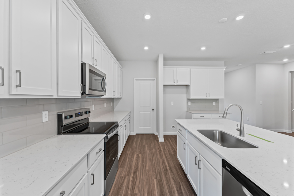 Dogwood Floor Plan Kitchen with White Cabinets at NorthShore in Kingsland