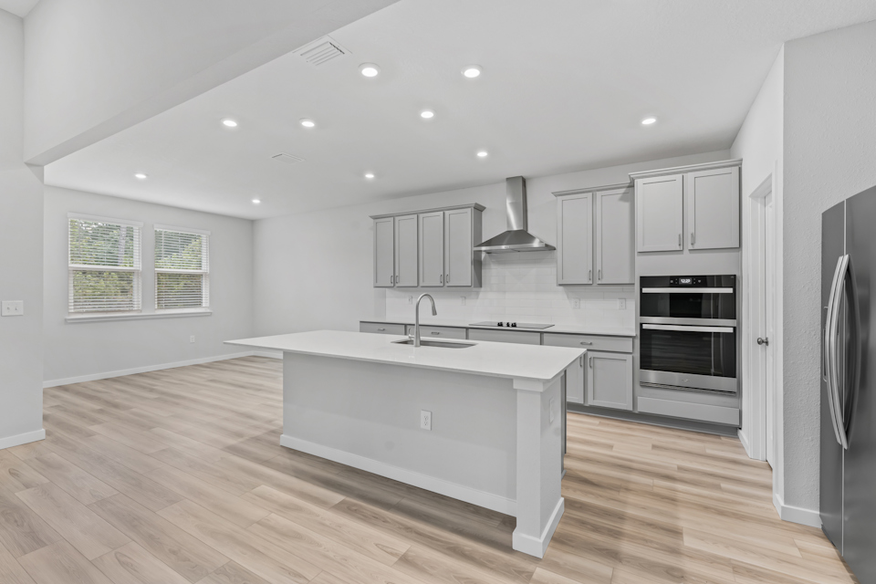 Dogwood Plan Lot 581 Chef's Kitchen Next to Breakfast Area at NorthShore in Kingsland