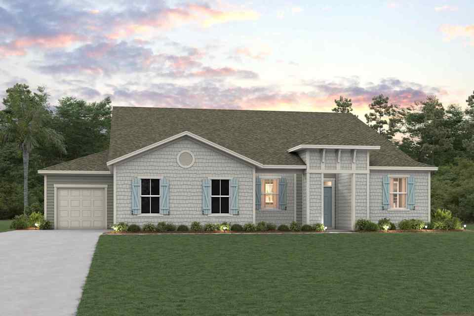 A house with a lawn in front of it.