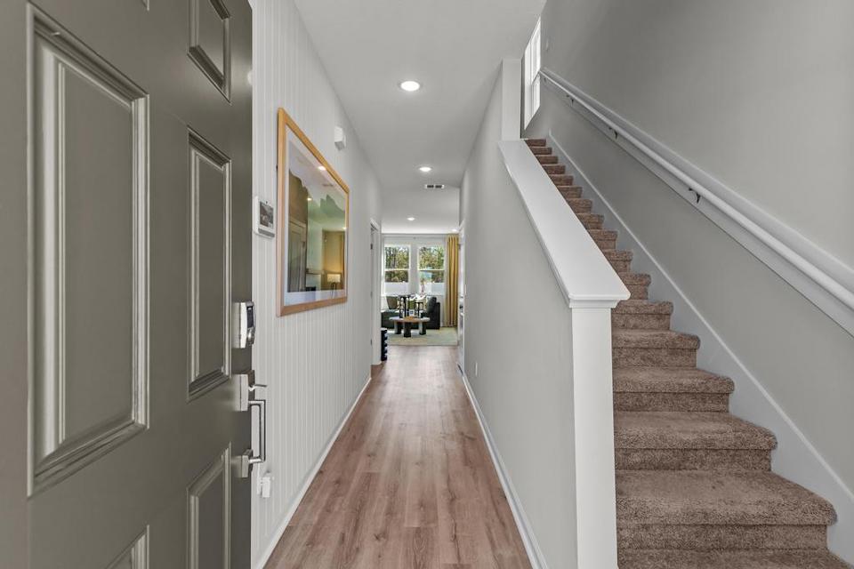 A hallway with white walls.
