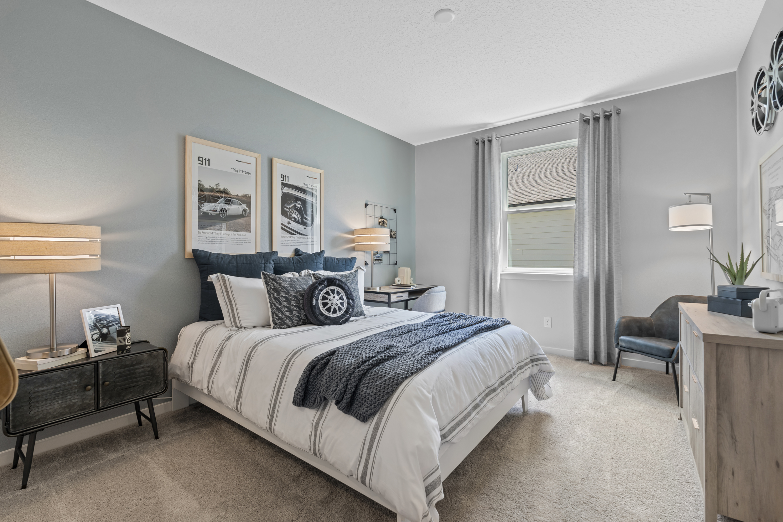 Coronado Model Home Guest Bedroom with Bed and Desk at Reserve East in Flagler Beach