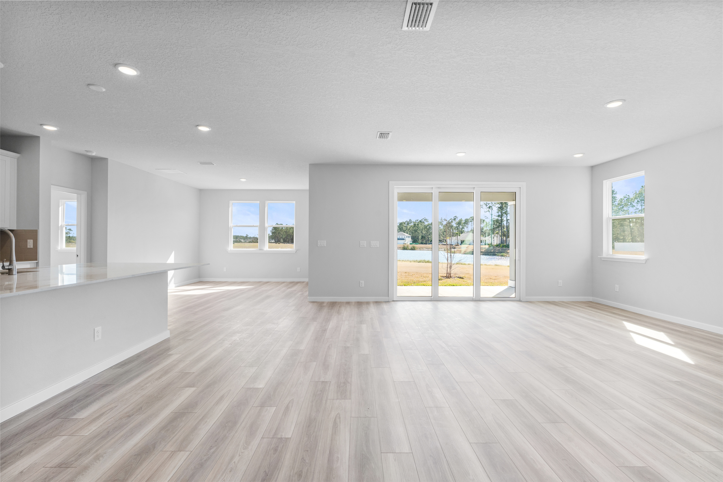 Lot 46 Open Great Room with Kitchen, Living, and Separate Dining Area at Reserve East