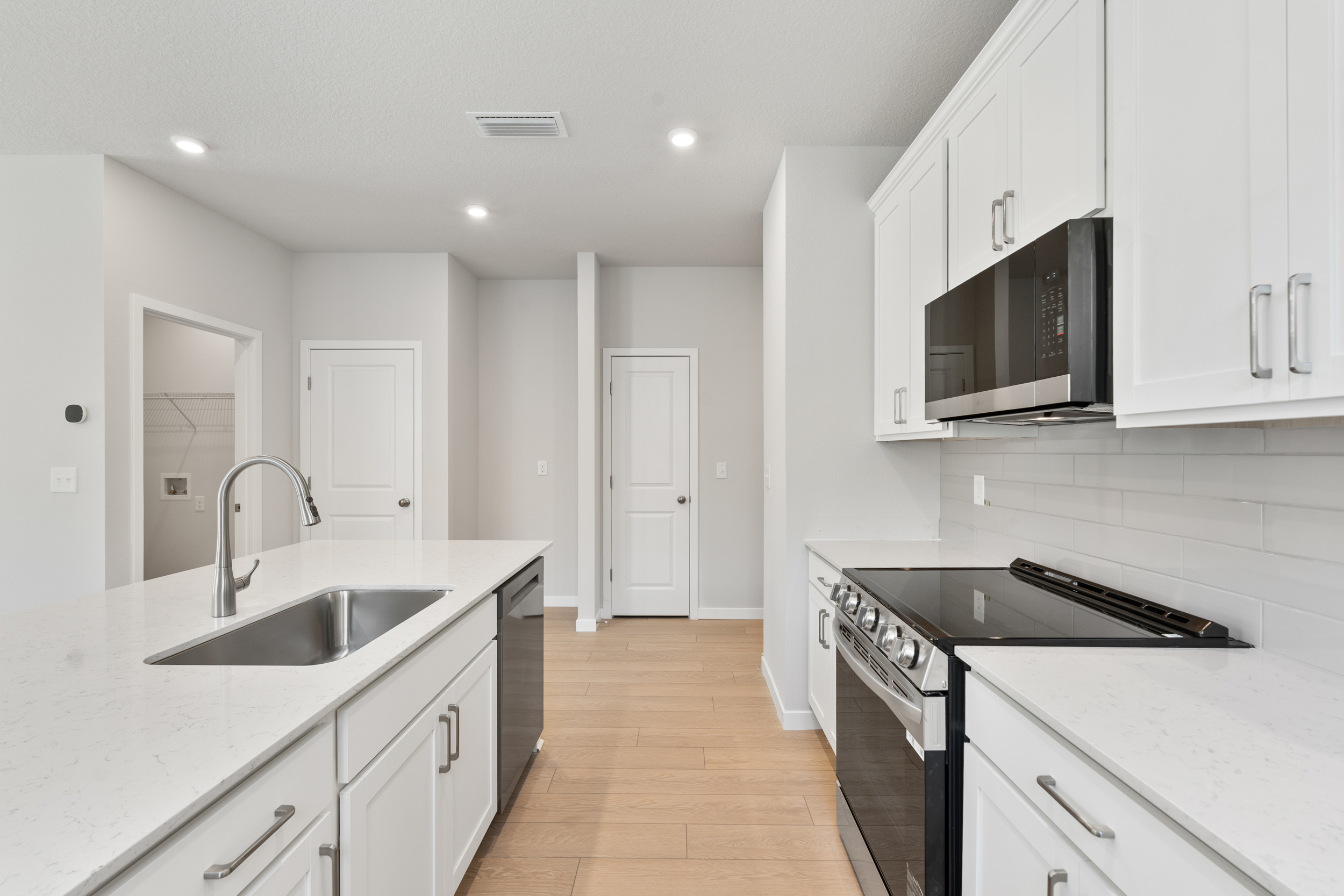 Lot 151 Kitchen with Stainless Steel Appliances at Seminole Palms