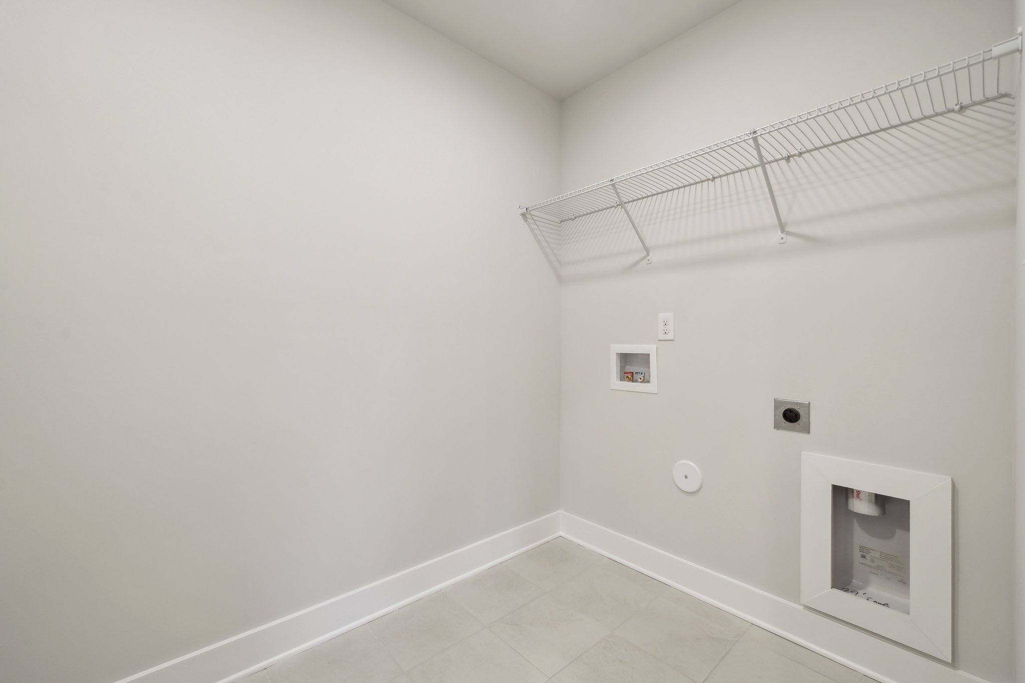 A white wall with a vent.