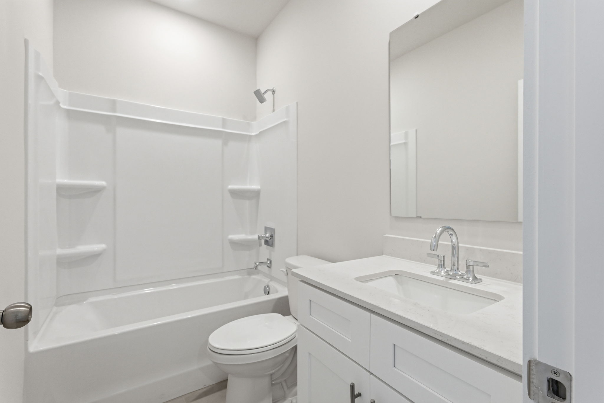 A bathroom with a sink toilet and bathtub.
