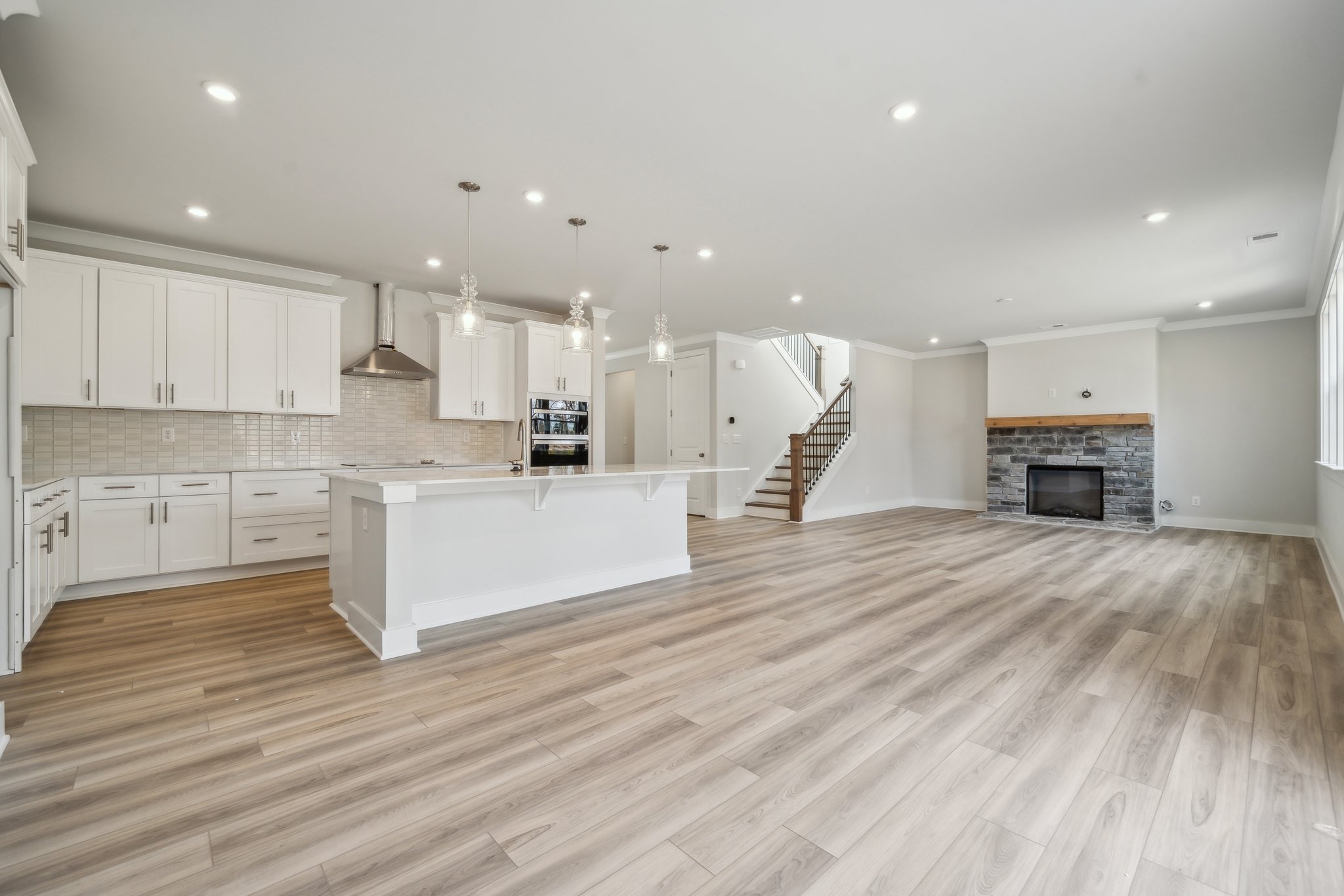 A large kitchen with white cabinets.