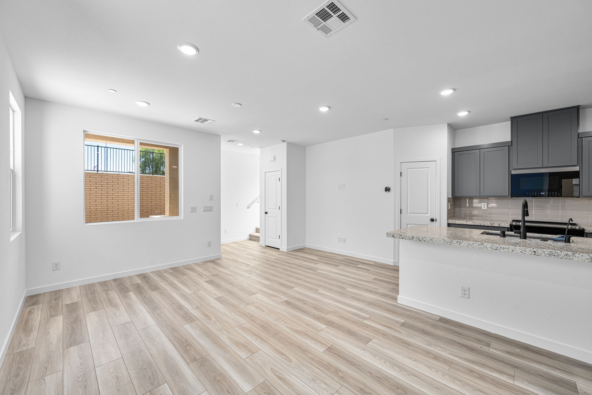 A large kitchen with white cabinets.