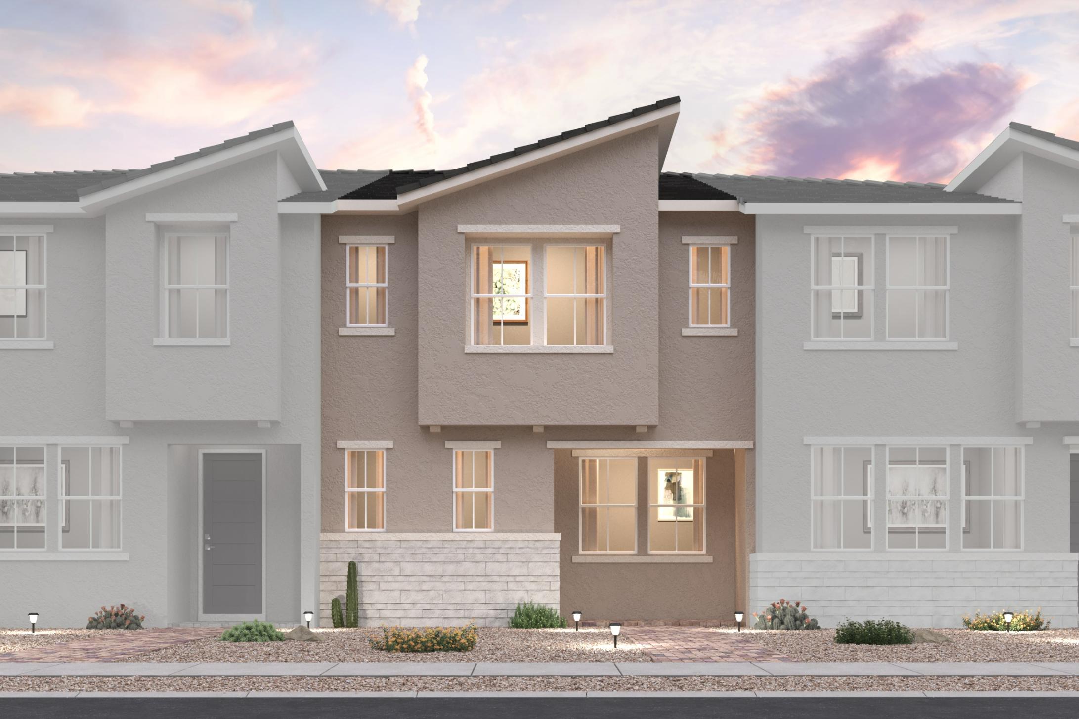 A grey house with a driveway.