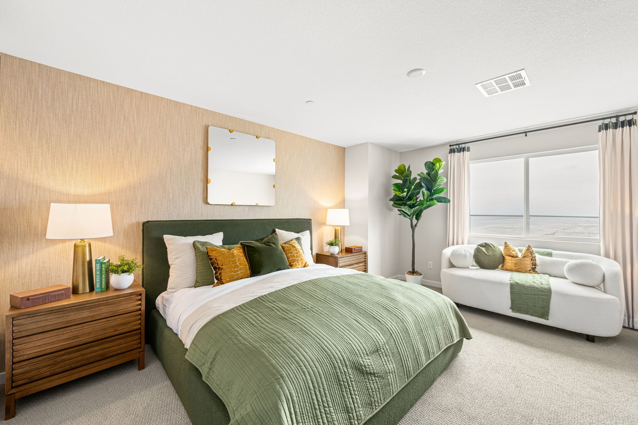 A bedroom with a bed and a couch.