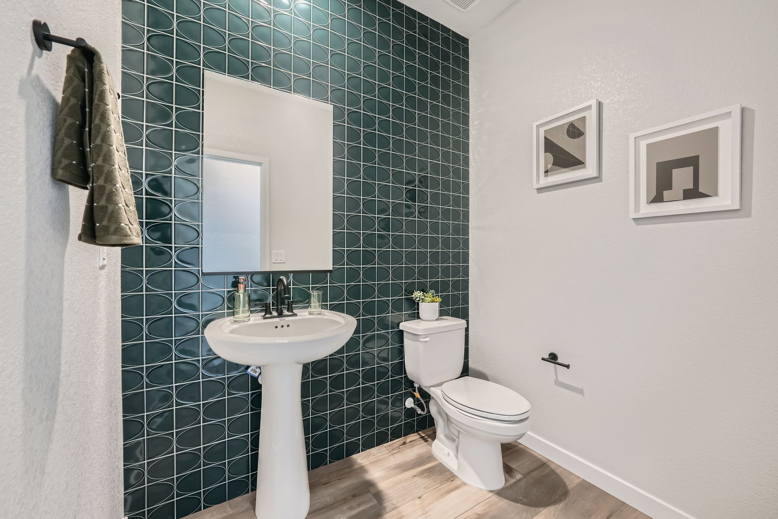 A bathroom with a toilet and sink.