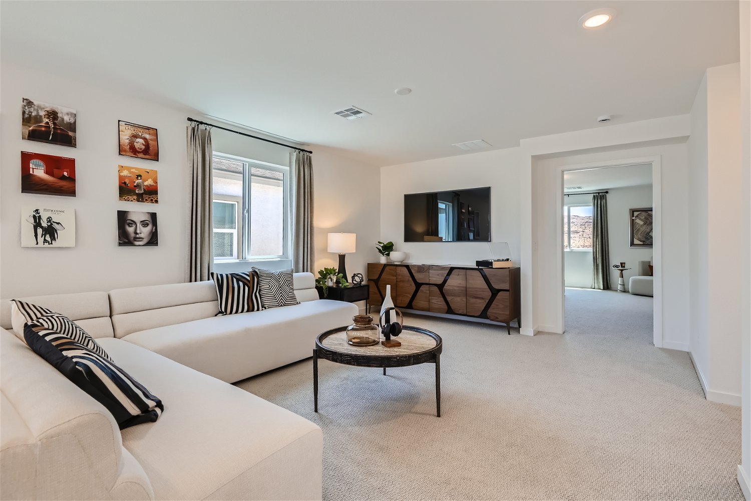 A living room with a couch and a table.