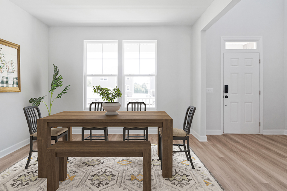 A dining room table with chairs and a plant on it.