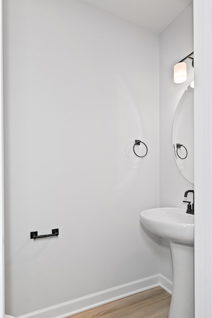 A bathroom with a mirror and sink.