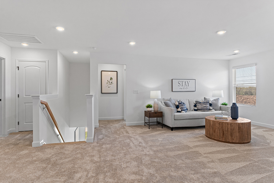 A living room with a couch and a table.