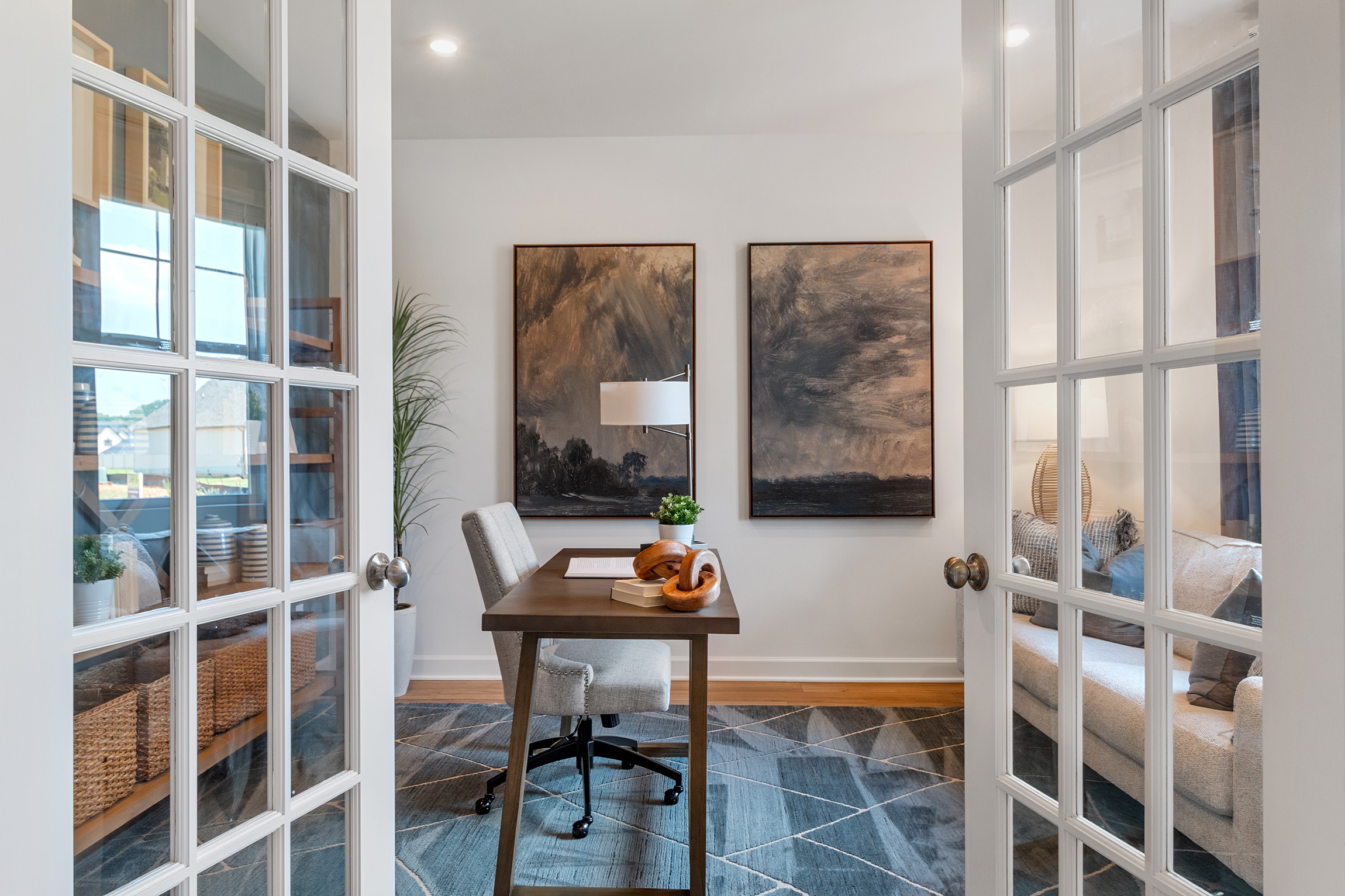 A room with a table and chairs.