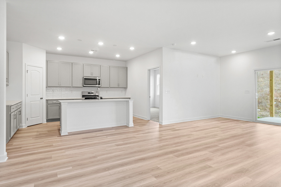 A large kitchen with white cabinets.
