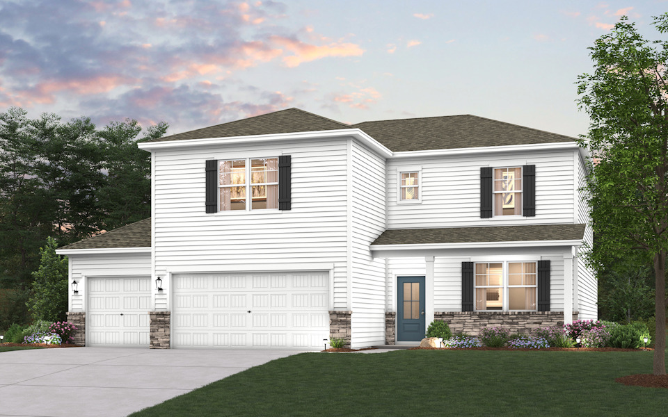 A white house with a garage.