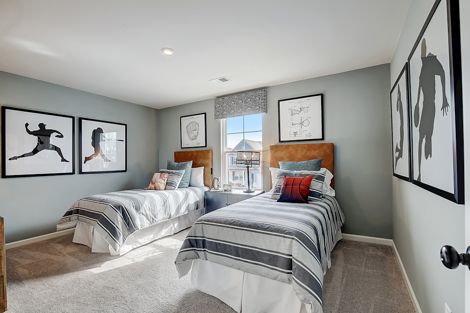 A bedroom with two beds.