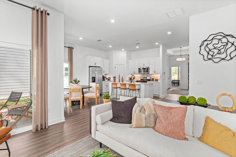 A living room with a couch and a table.