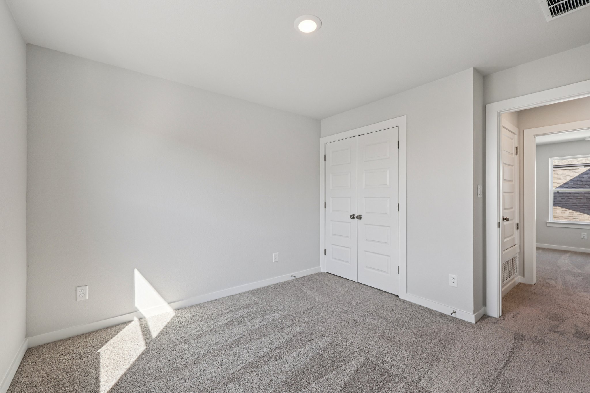 A room with white doors.