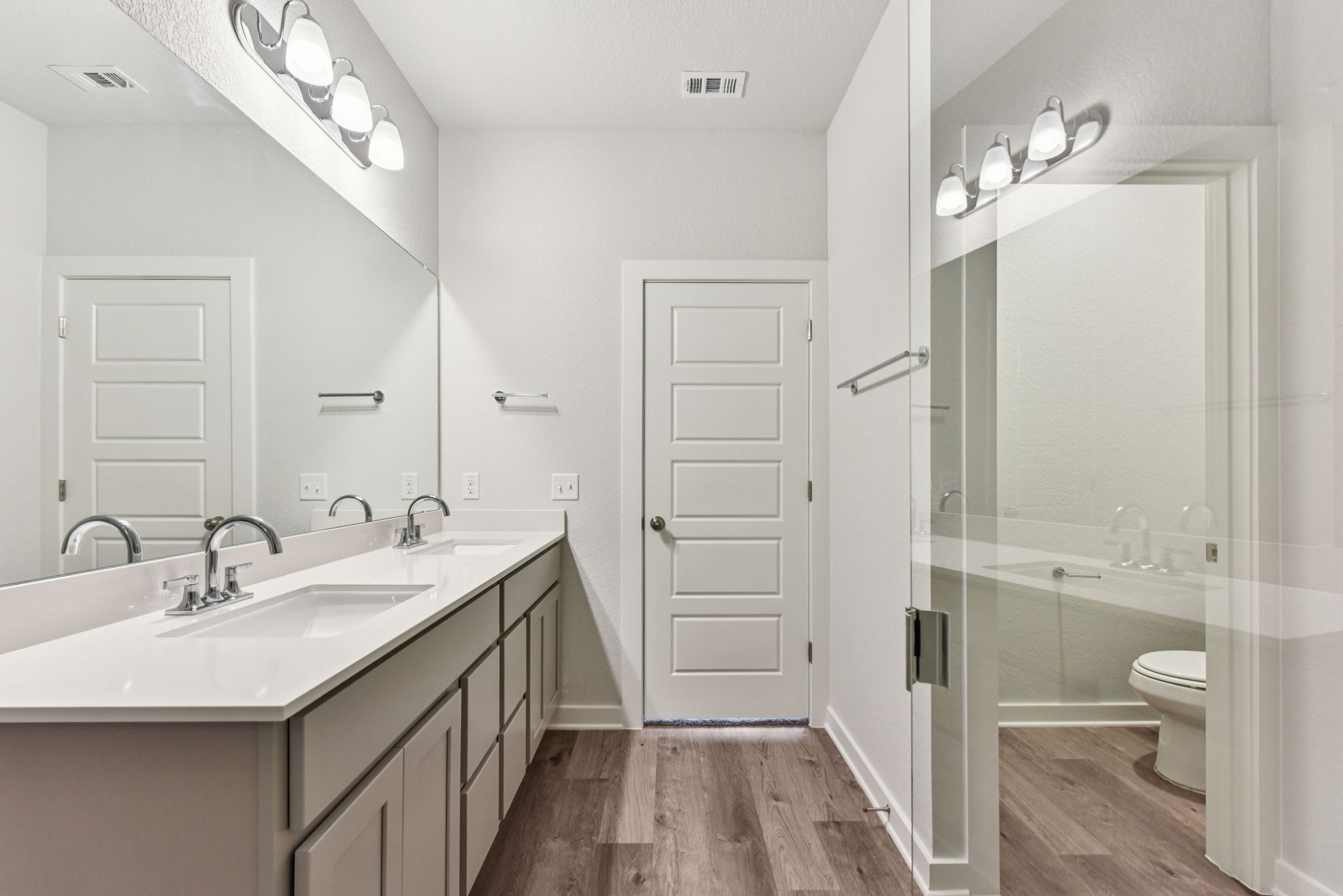 A bathroom with a glass shower.
