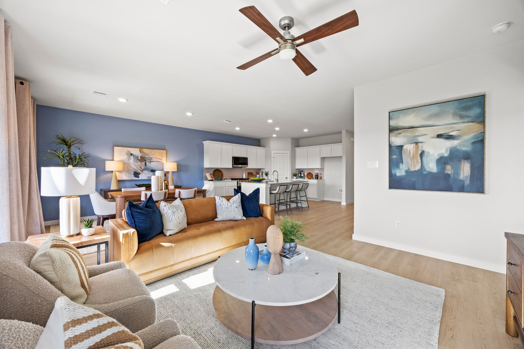 A living room with a couch and a table.