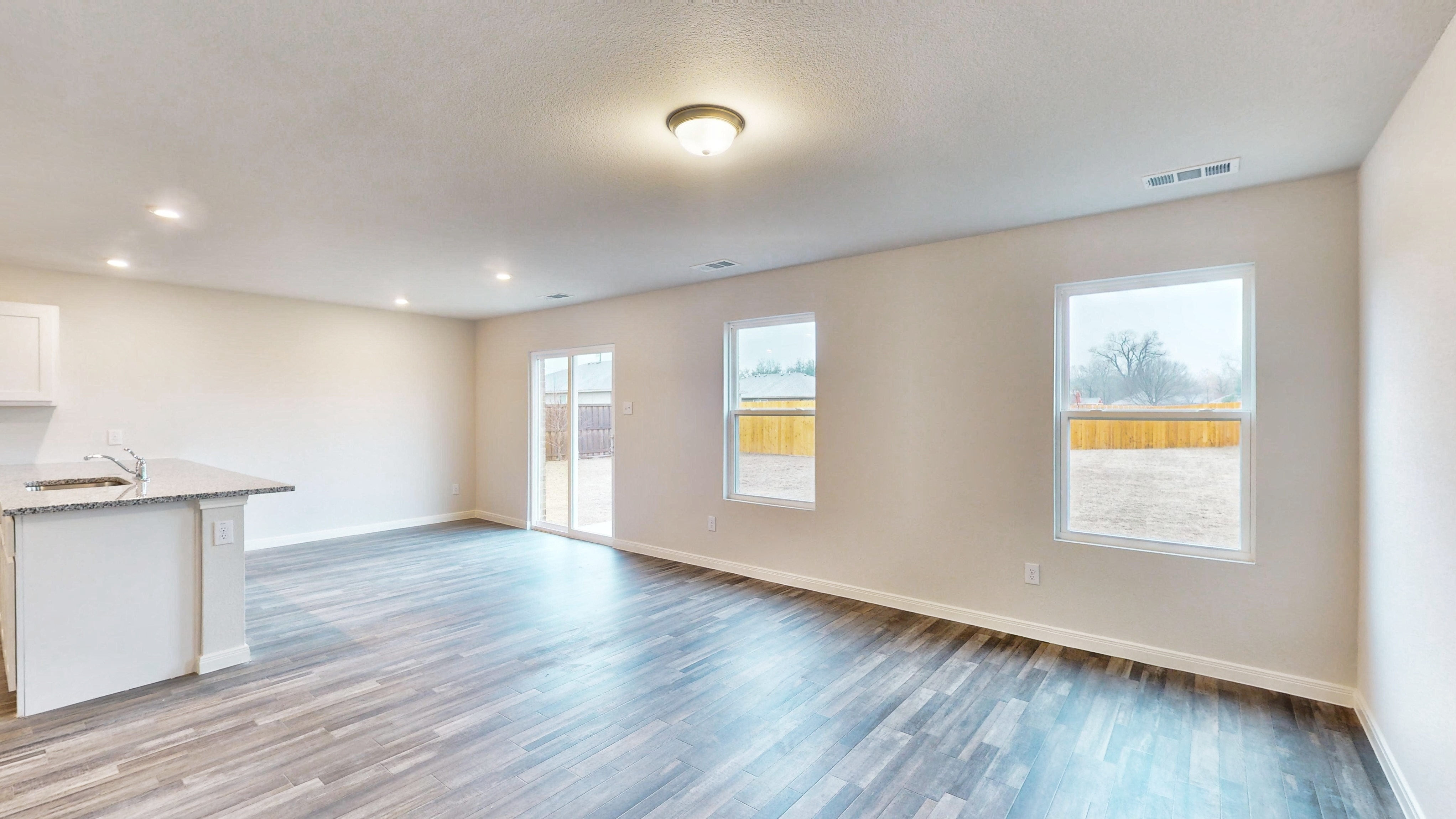 A large empty room with a large window.