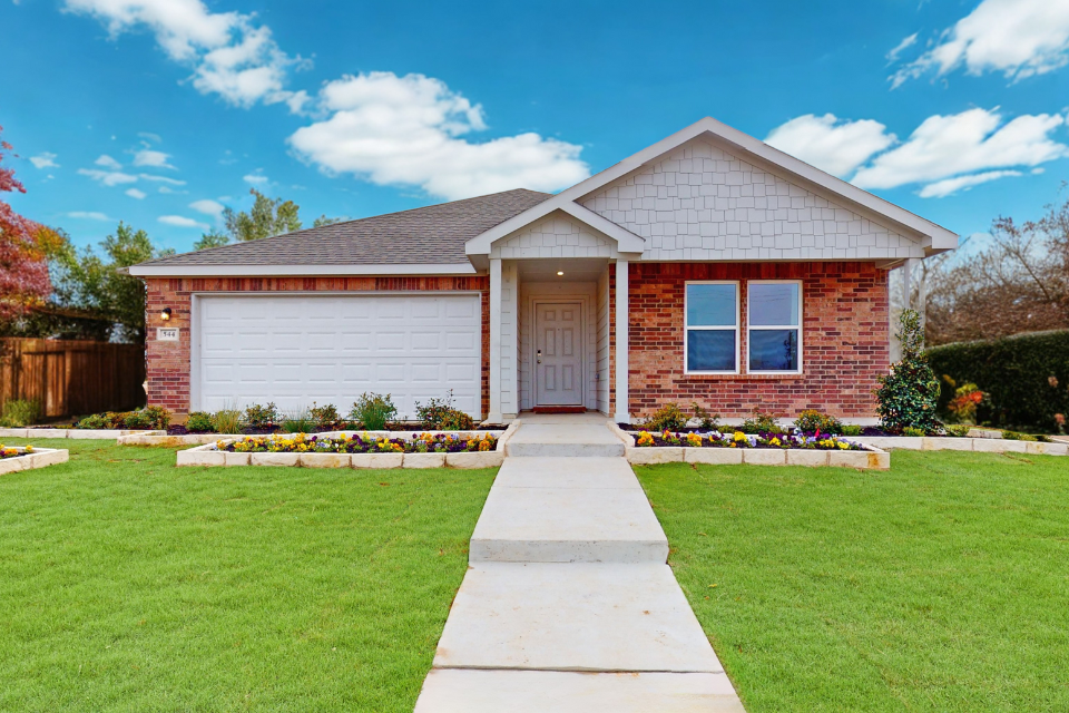 A house with a large front yard.