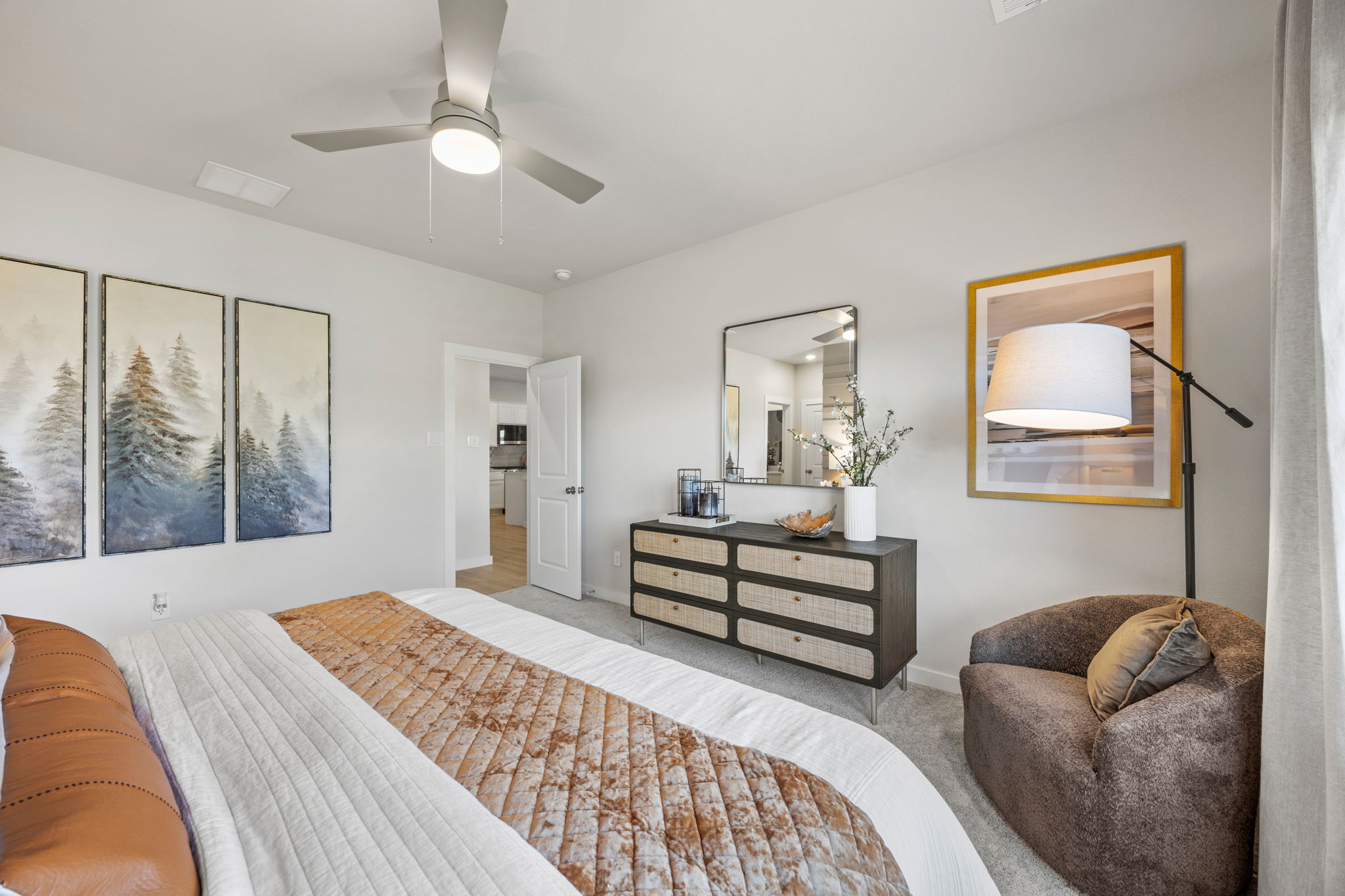 A bedroom with a bed and a couch.