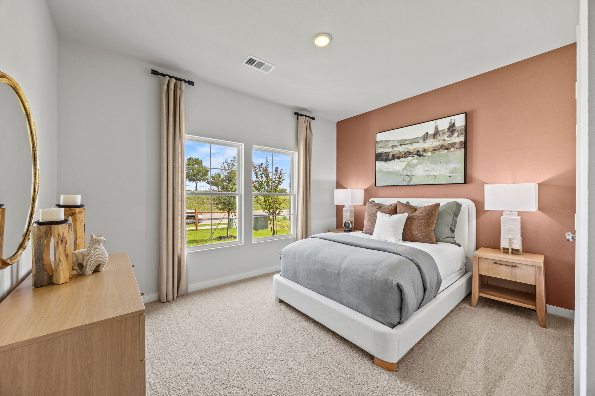 A bedroom with a large window.