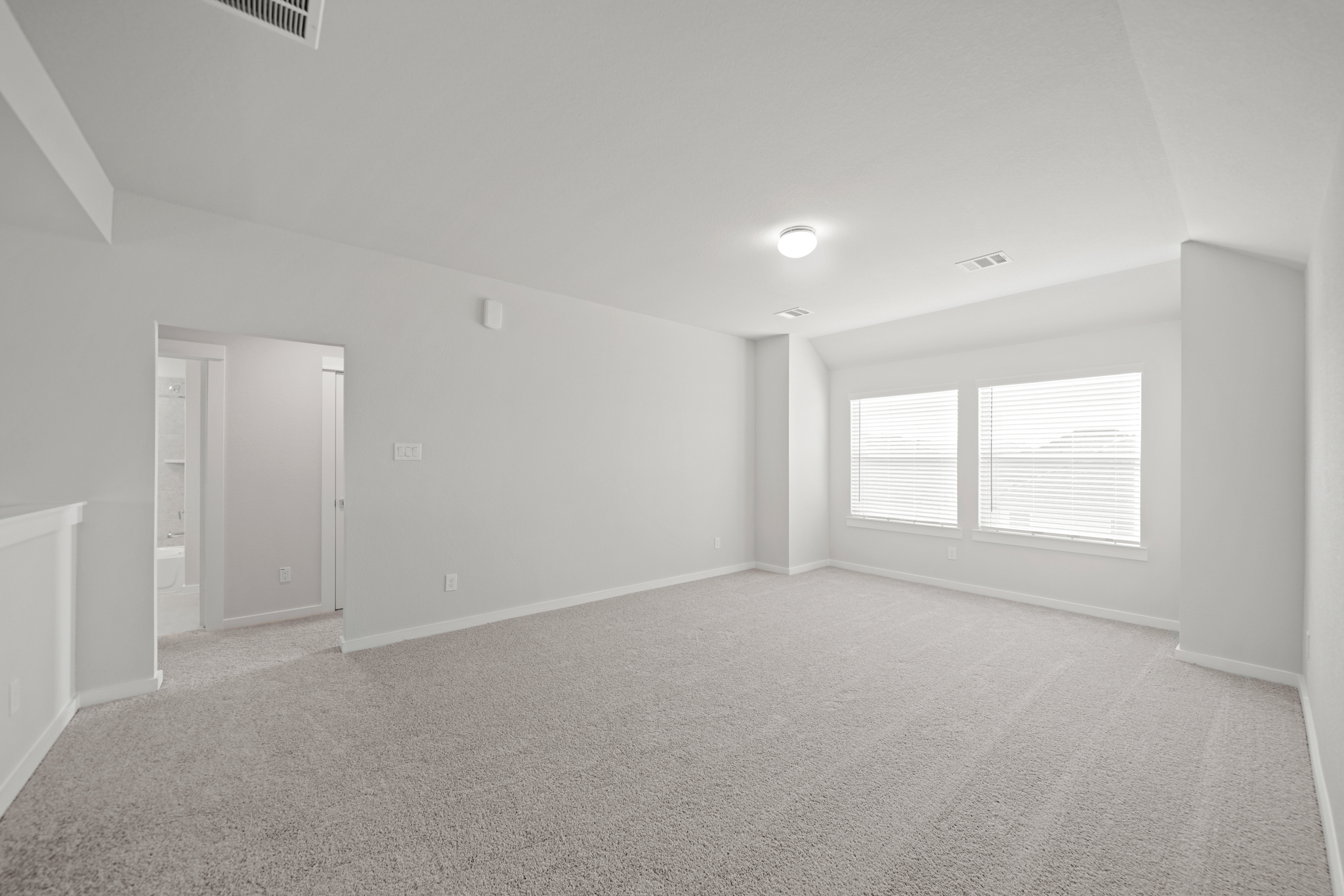 A room with a door and windows.