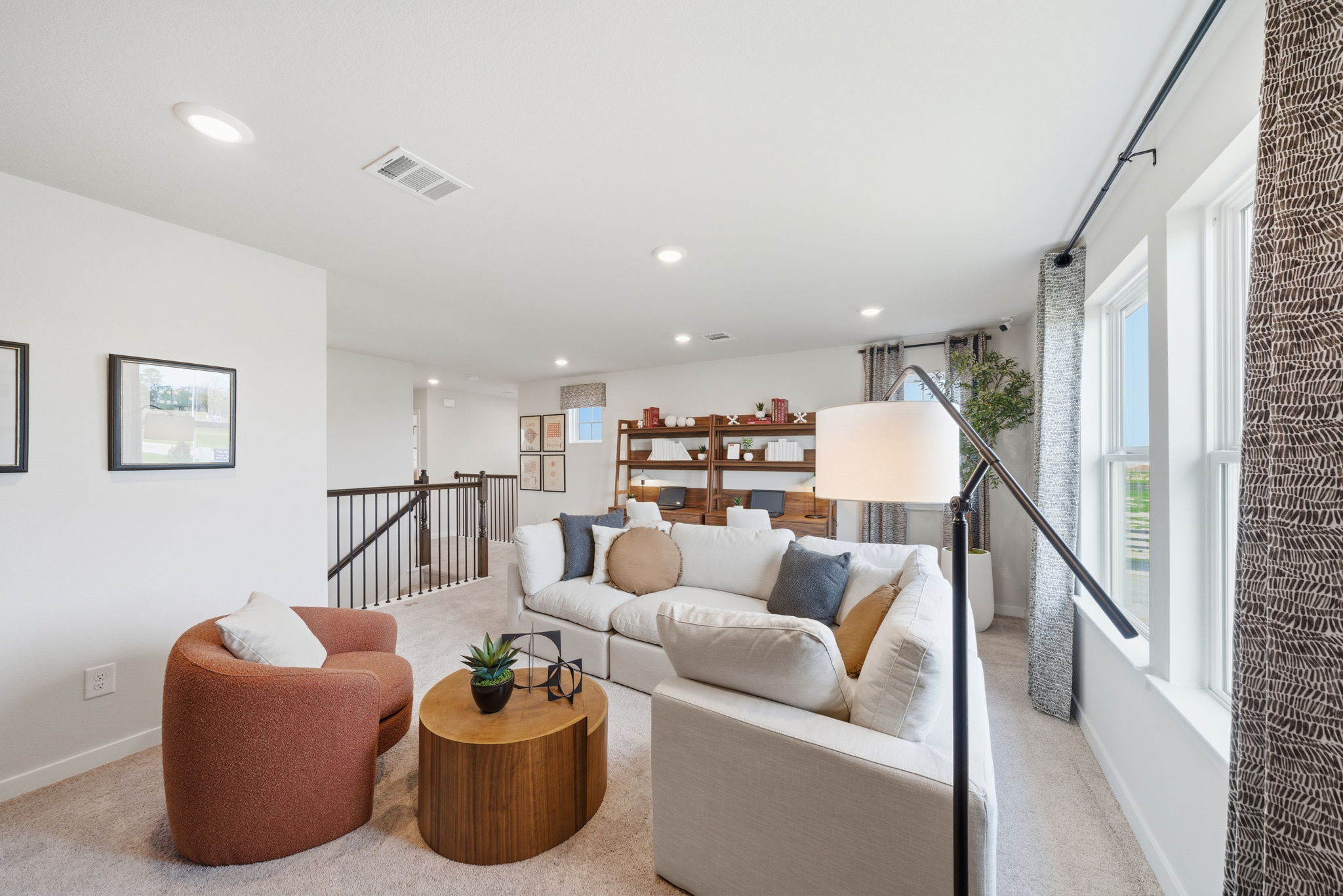 A living room with a couch and a table.