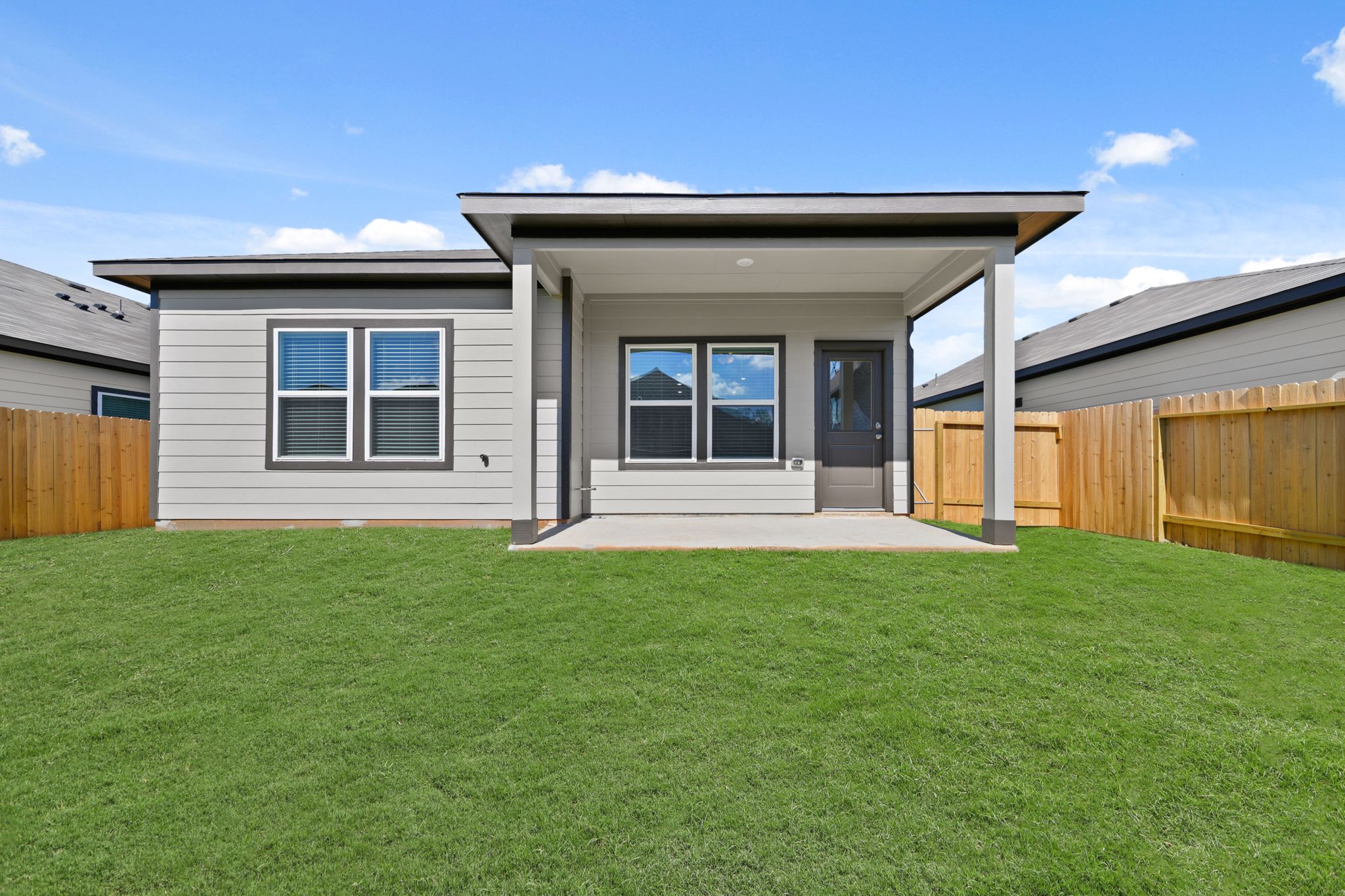 A house with a grass yard.