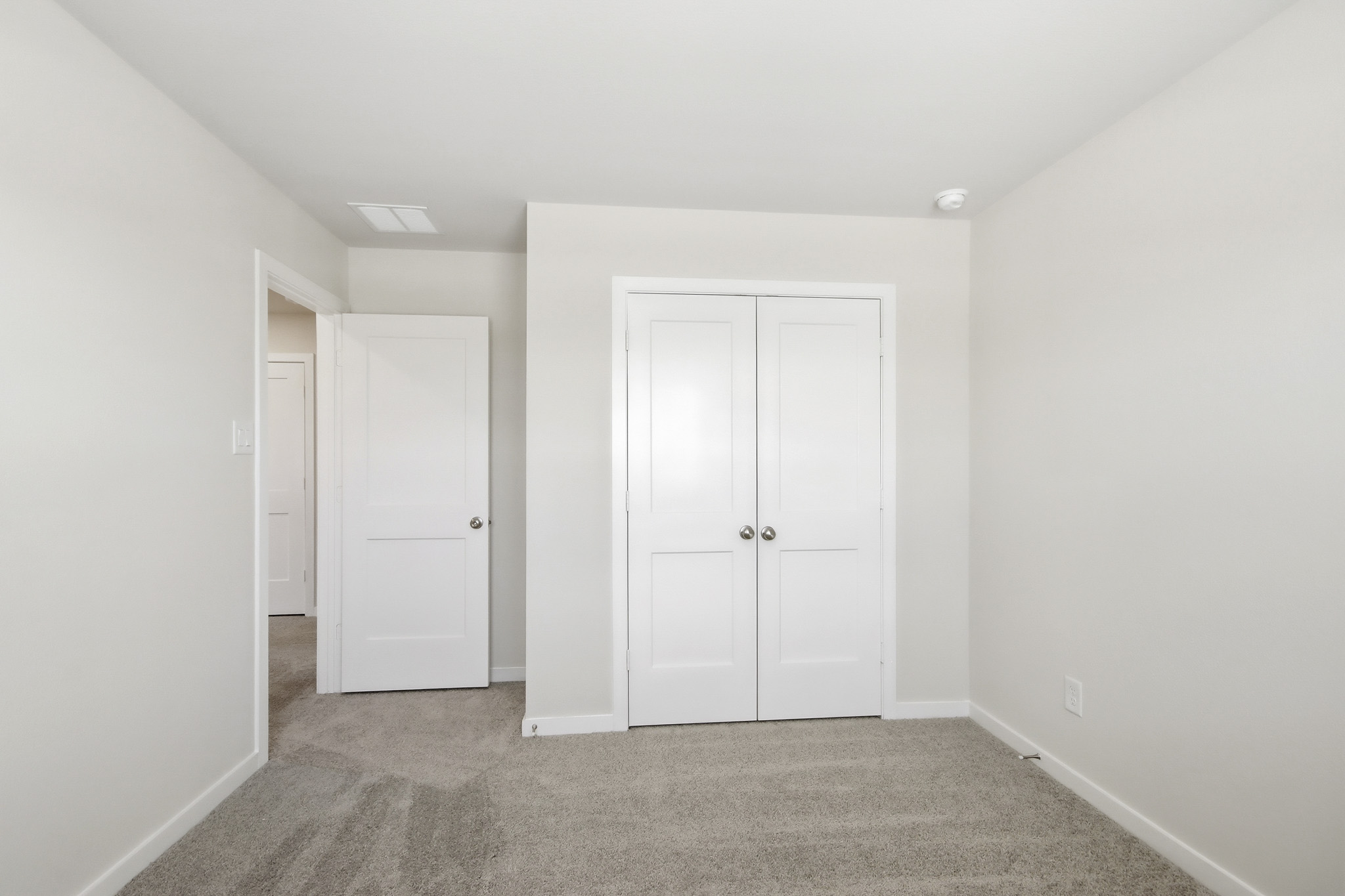 A room with white doors.