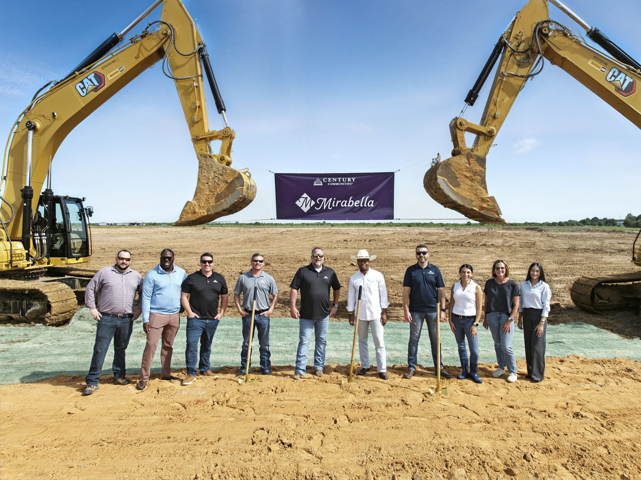 A group of people standing in front of a construction site.