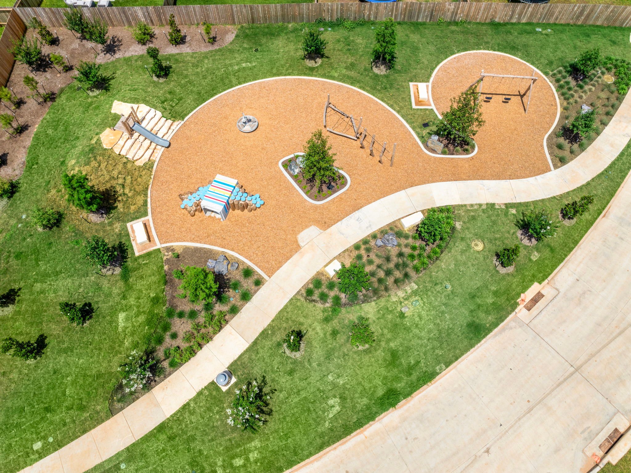 A large courtyard with a few buildings.