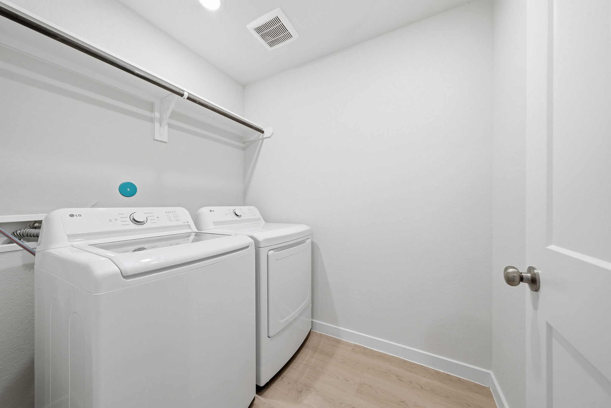 A washing machine in a room.