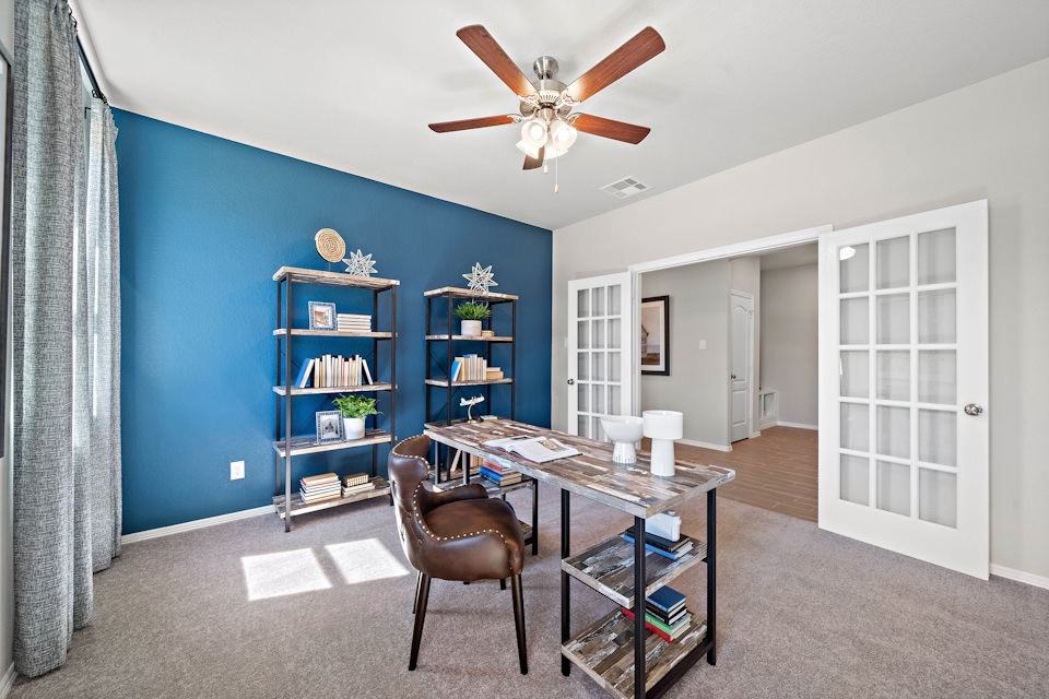 A room with a table and chairs.